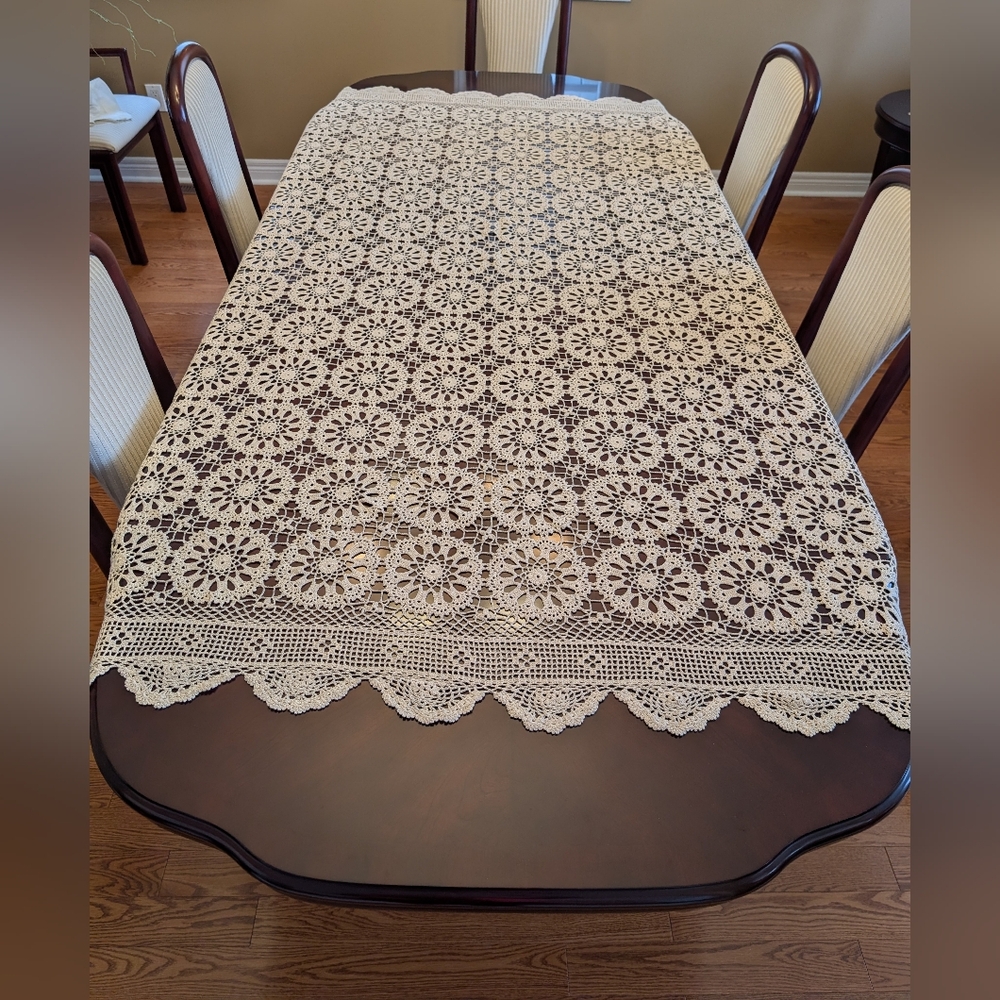 Handmade crochet tablecloth with scalloped edge